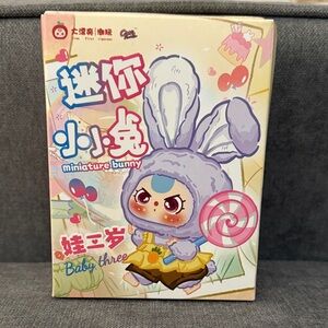 Miniature Bunny Toy with Gray and Yellow Outfit